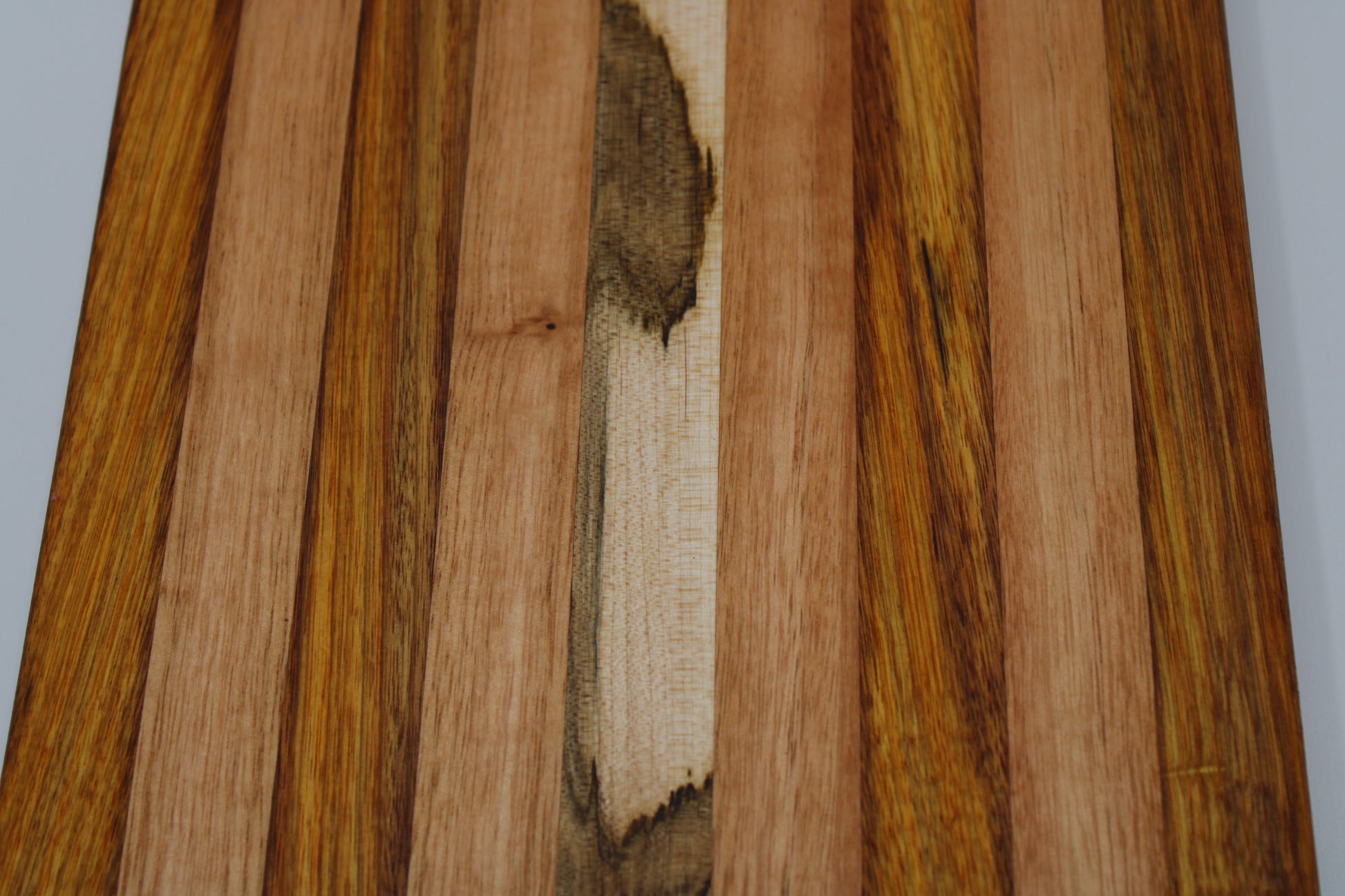 Design #025 wood used Canarywood, Red Grandis and Wormy Red Maple 15.75x8.5x1.5