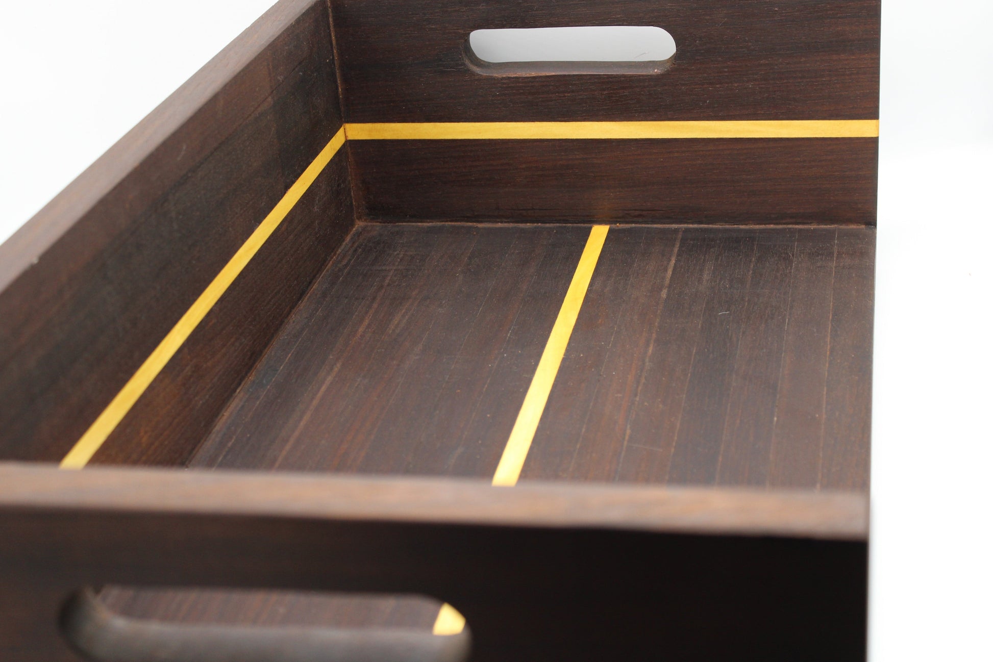 Wooden tray with a dark brown finish and yellow accent line on a white background