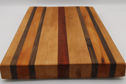 Wooden cutting board with striped pattern on a white background