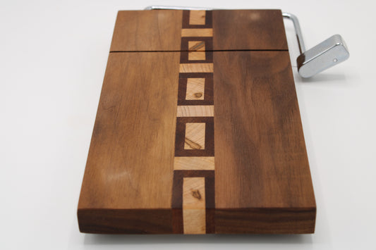 Wooden cutting board with a knife sharpener on a white background