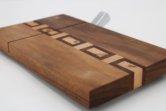 Wooden cutting board with geometric patterns on a white background