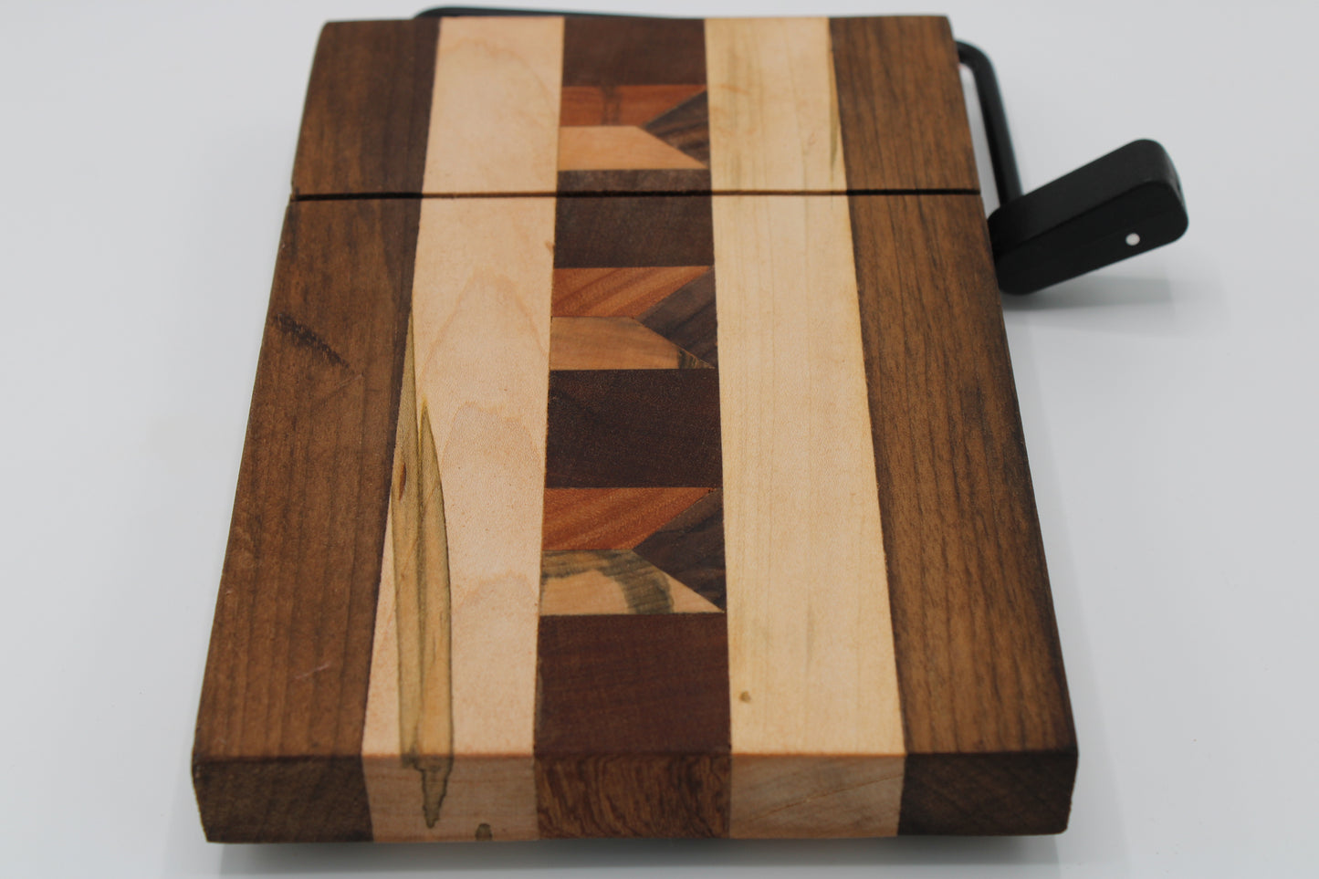 Wooden cheese  board with slicer on a white background
