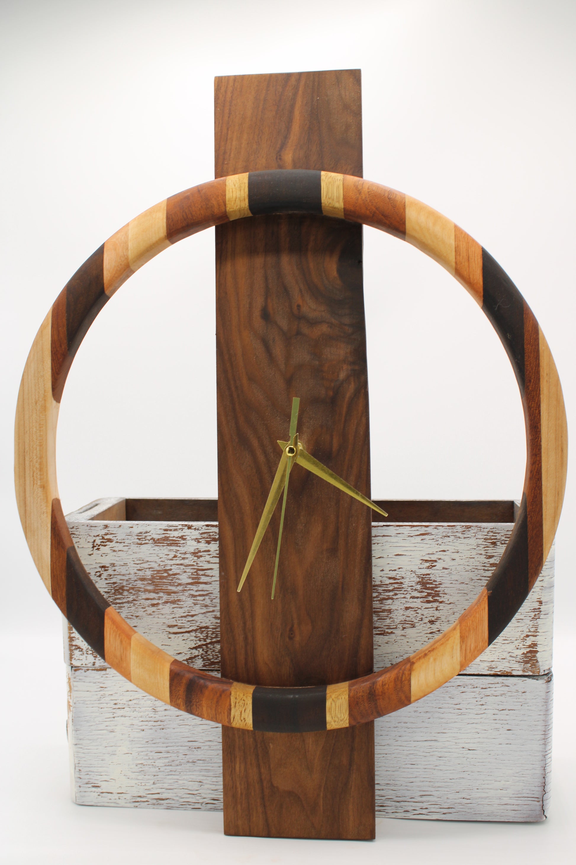 Wooden wall clock with a circular design on a wooden background