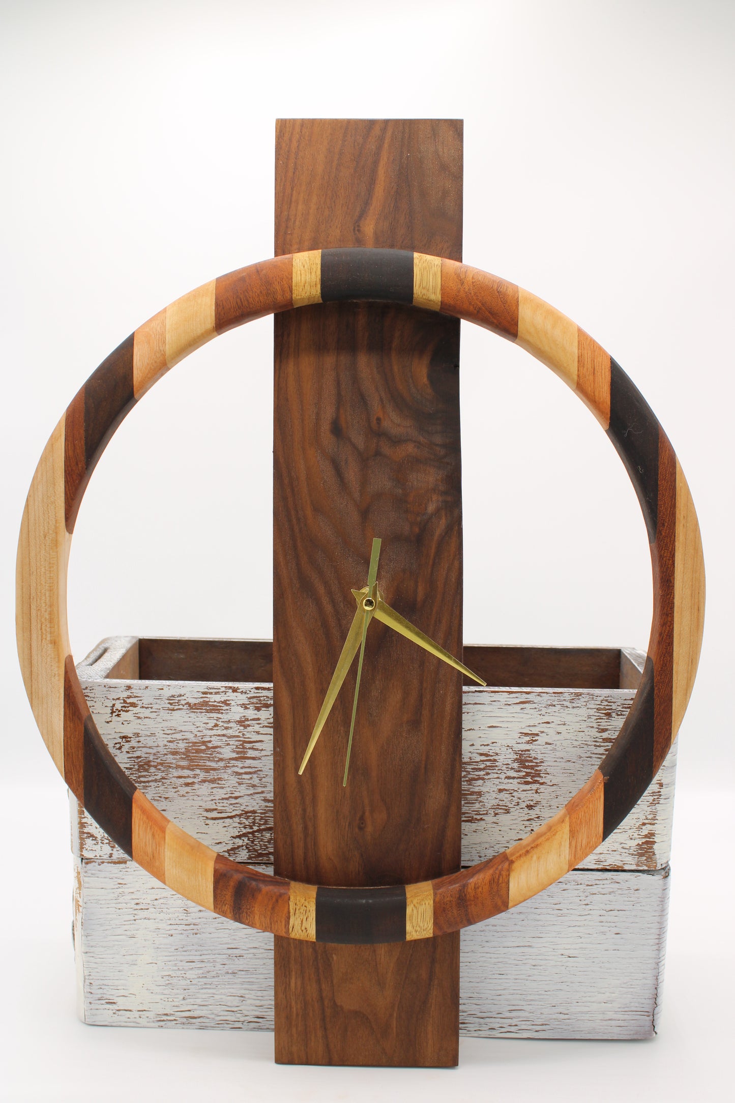 Wooden wall clock with a circular design on a wooden background