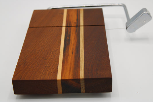 Wooden cheese board with slicer on a white background