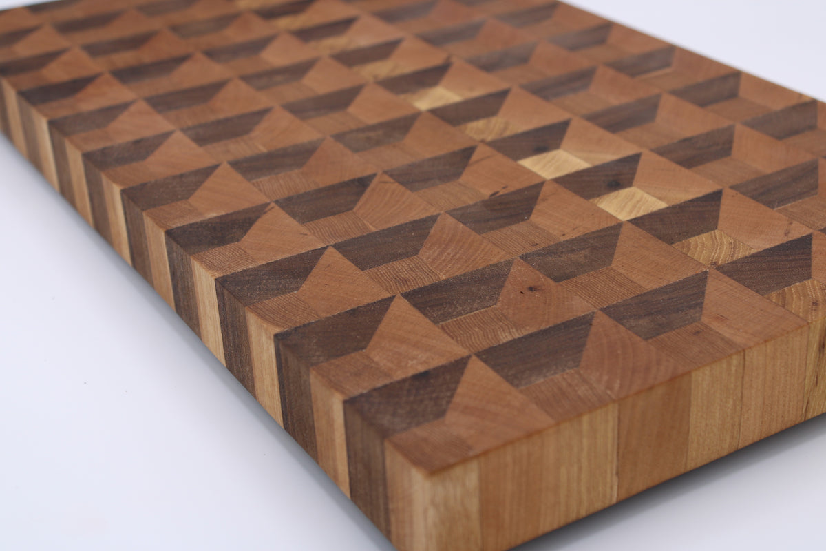 Wooden cutting board with geometric pattern on a white background