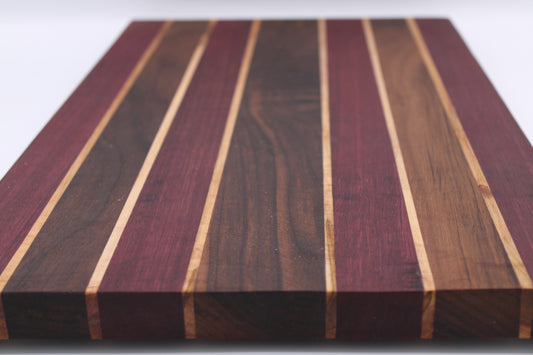 Wooden cutting board with striped pattern on a white background