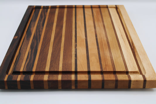 Wooden cutting board with striped pattern on a white background