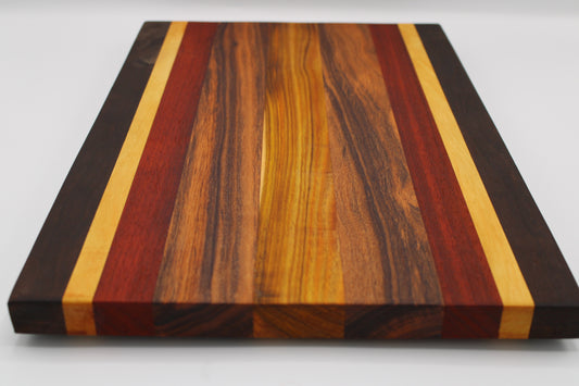 Wooden cutting board with multicolored stripes on a white background