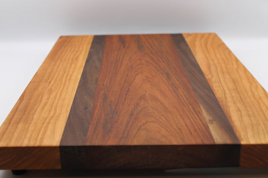 Wooden cutting board with a striped pattern on a white background