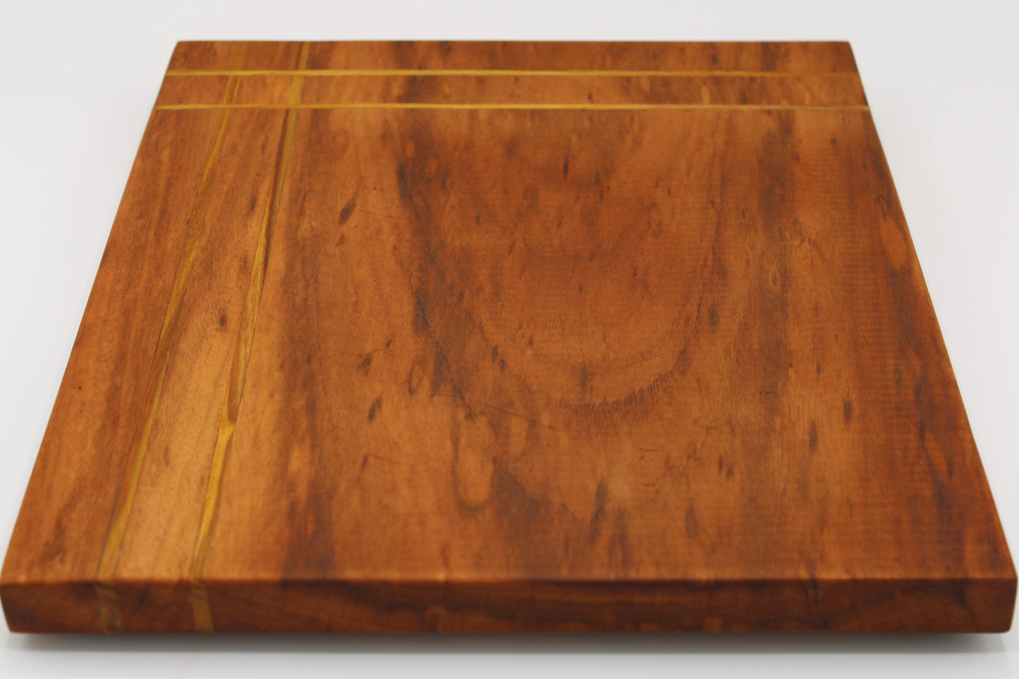 Wood cutting board with inlaid stripes
