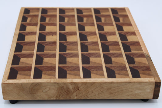 Wood cutting board with three dimensional design