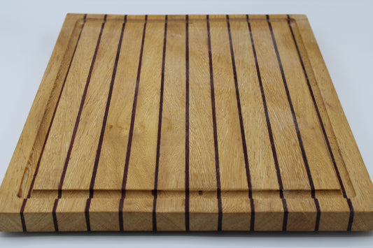 Wood butting board with purple and tan stripes