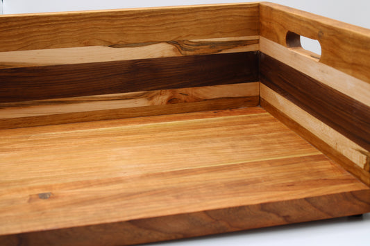 A close-up of a BBQ Chopping Box with a handle cutout, featuring alternating light and dark wood grain stripes.