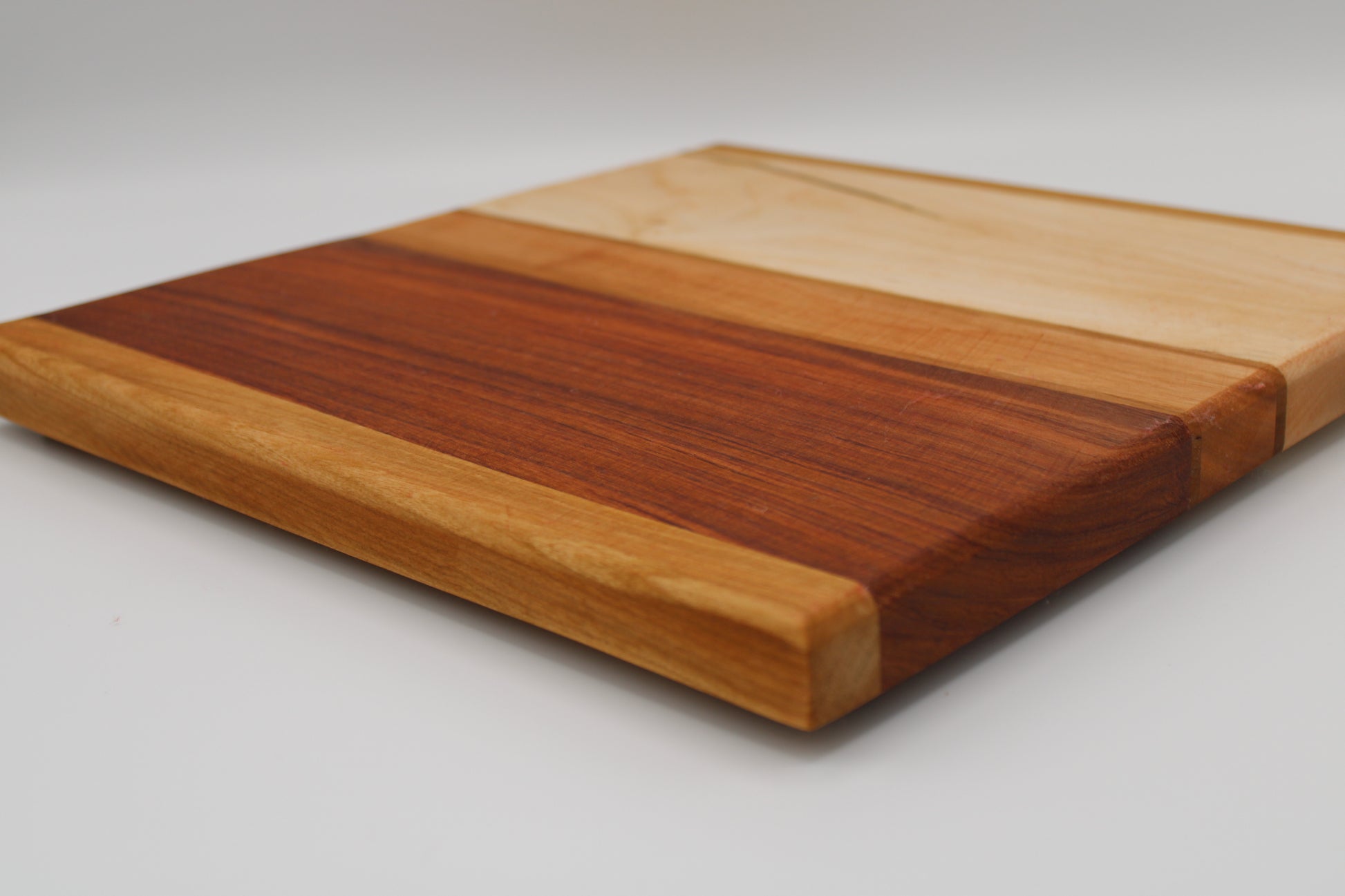 Design #026 wood used Cherry, Bubinga, Canarywood and Wormy Red Maple 12.5x12.5x1