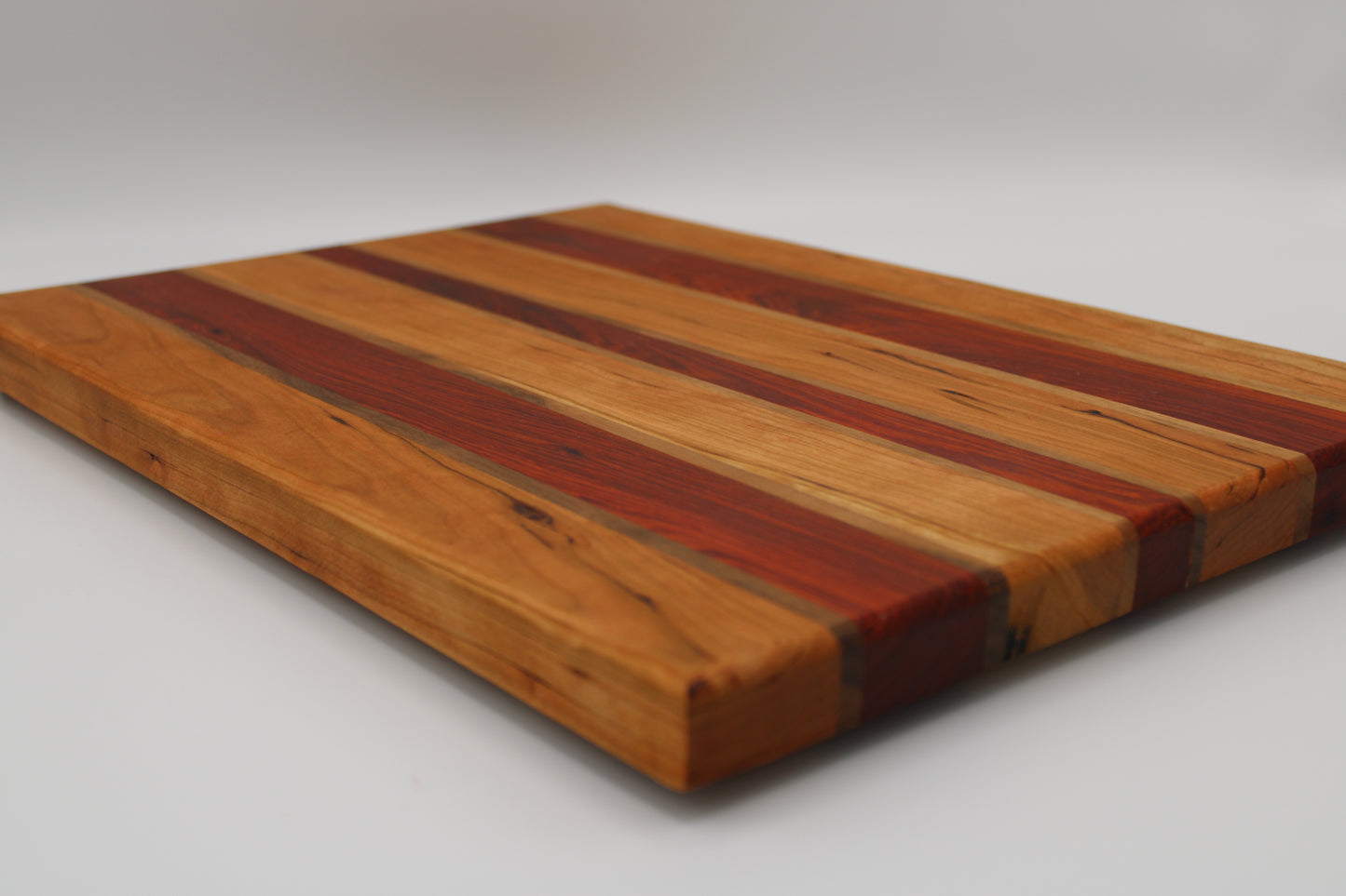 Design #021 wood used Tigerwood, Walnut and Sapele 15.75x11.25x1