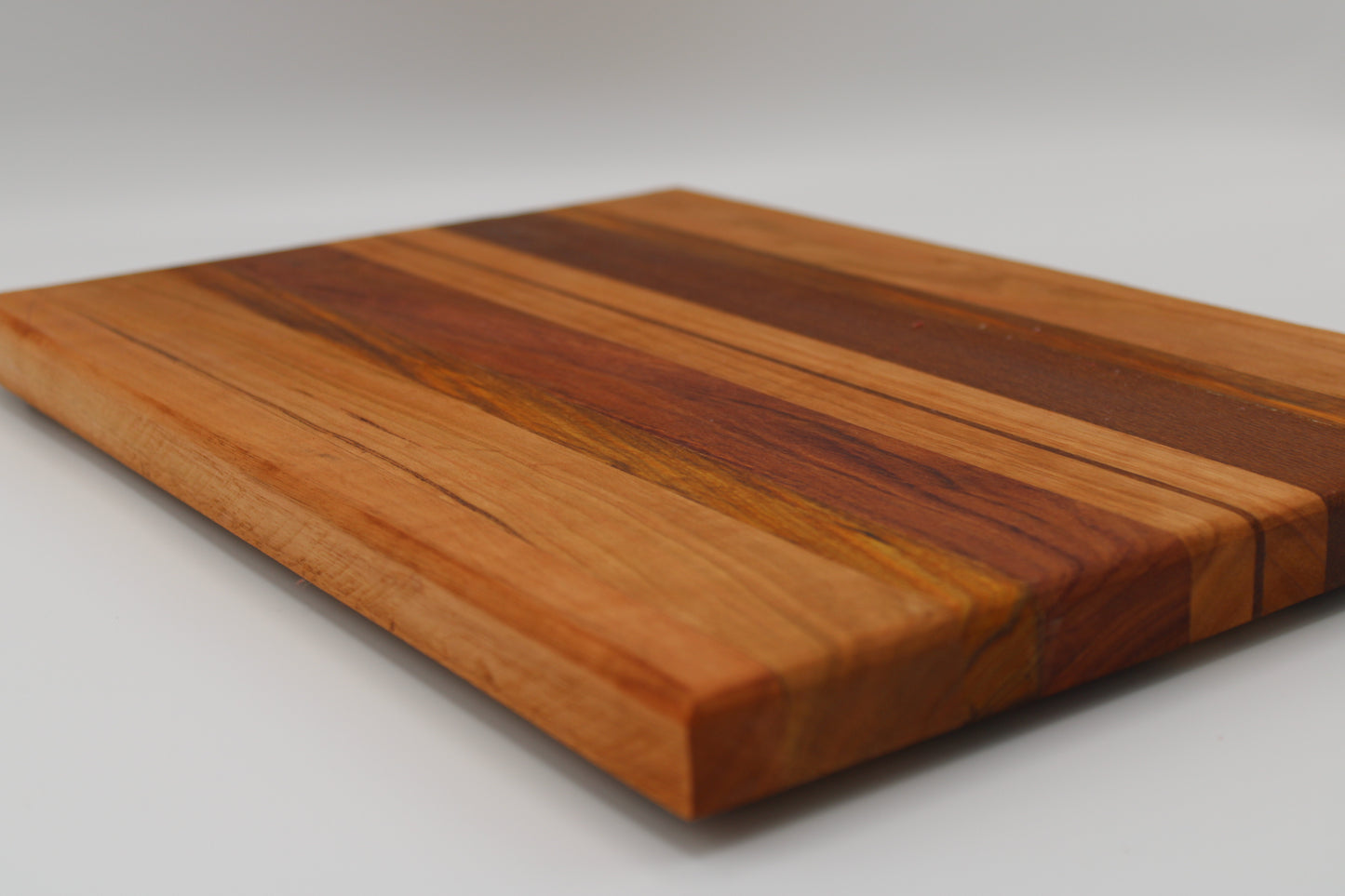 Design #014 wood used Cherry, Red Grandis, Canarywood, Leopardwood, Bubinga 14.5x10.25x1