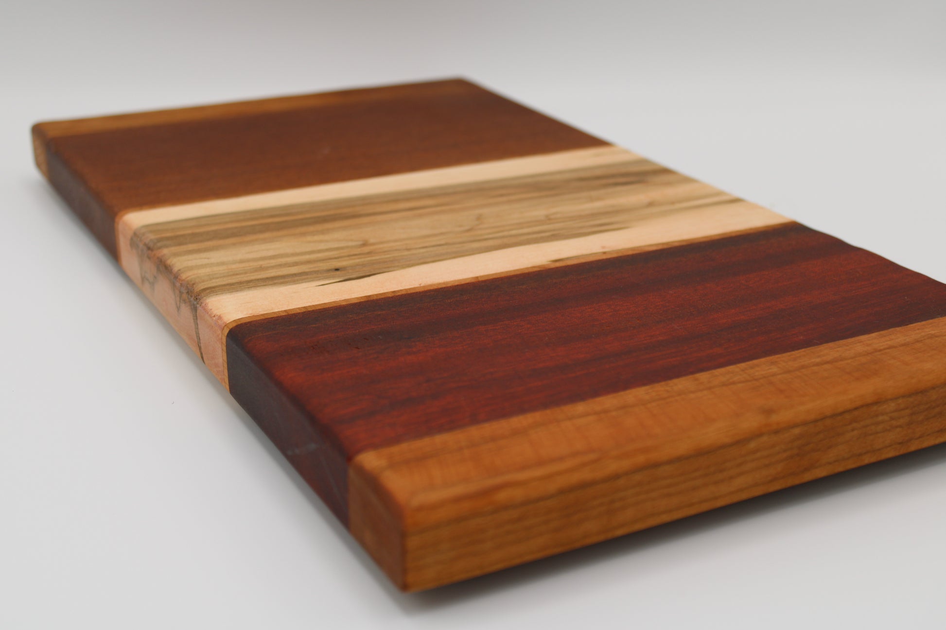 Design #022 wood used Leopardwood, Red Grandis, Wormy Red Maple, Padauk 16.5x9.25x1