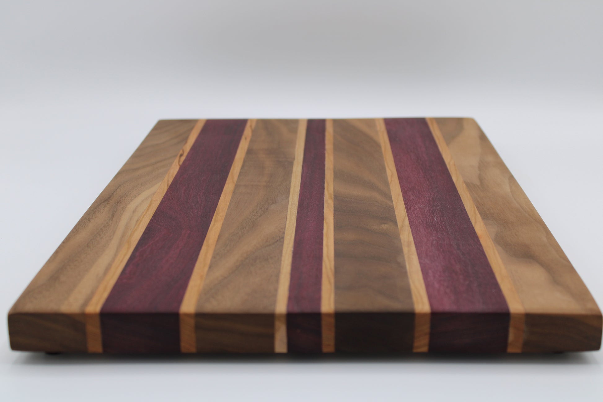 Design #019 wood used Cherry, Purpleheart and Walnut 15.75x11.25x1