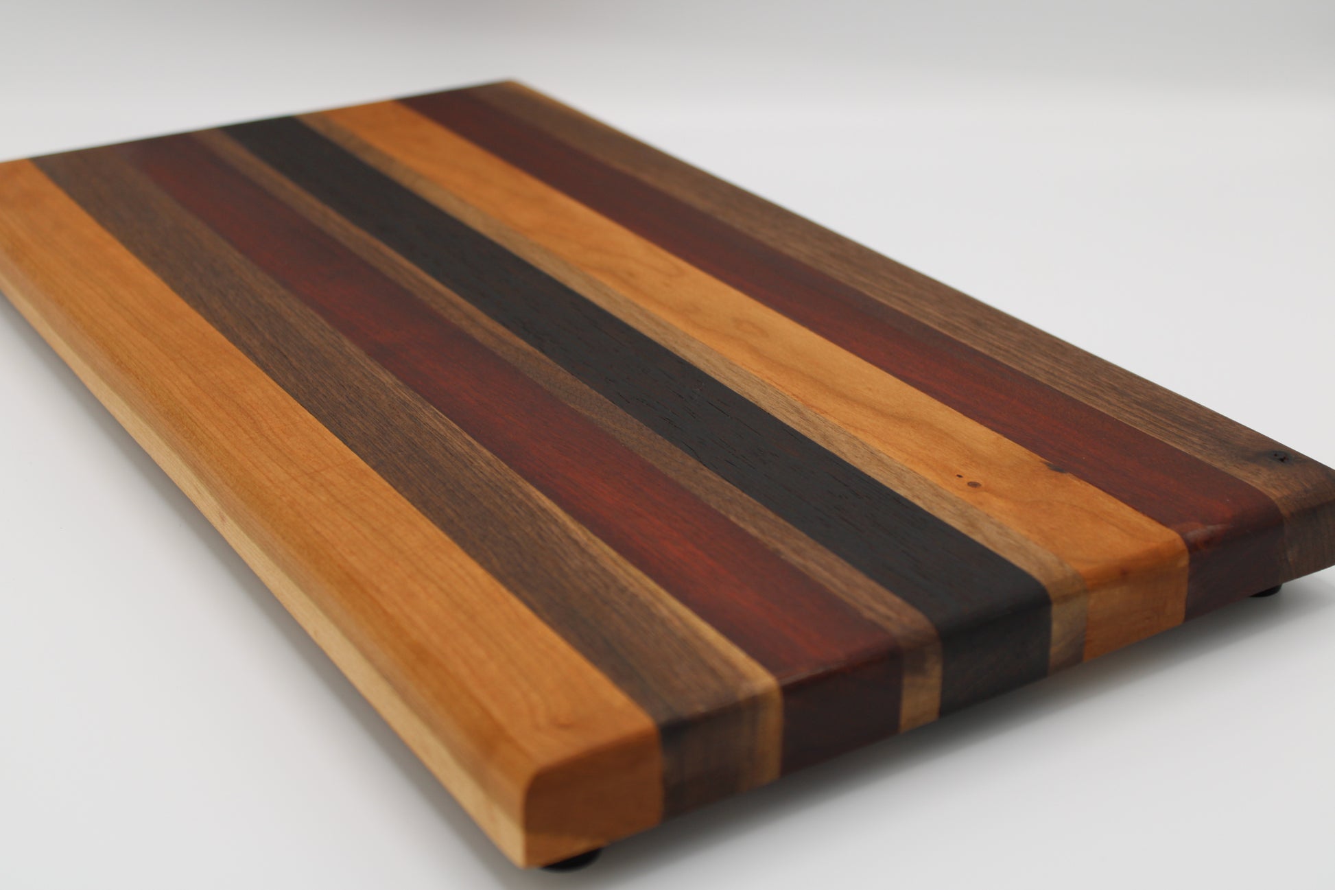 Design #010 wood used Cherry, Walnut, Bloodwood and Wenge 17.75x9.5x1