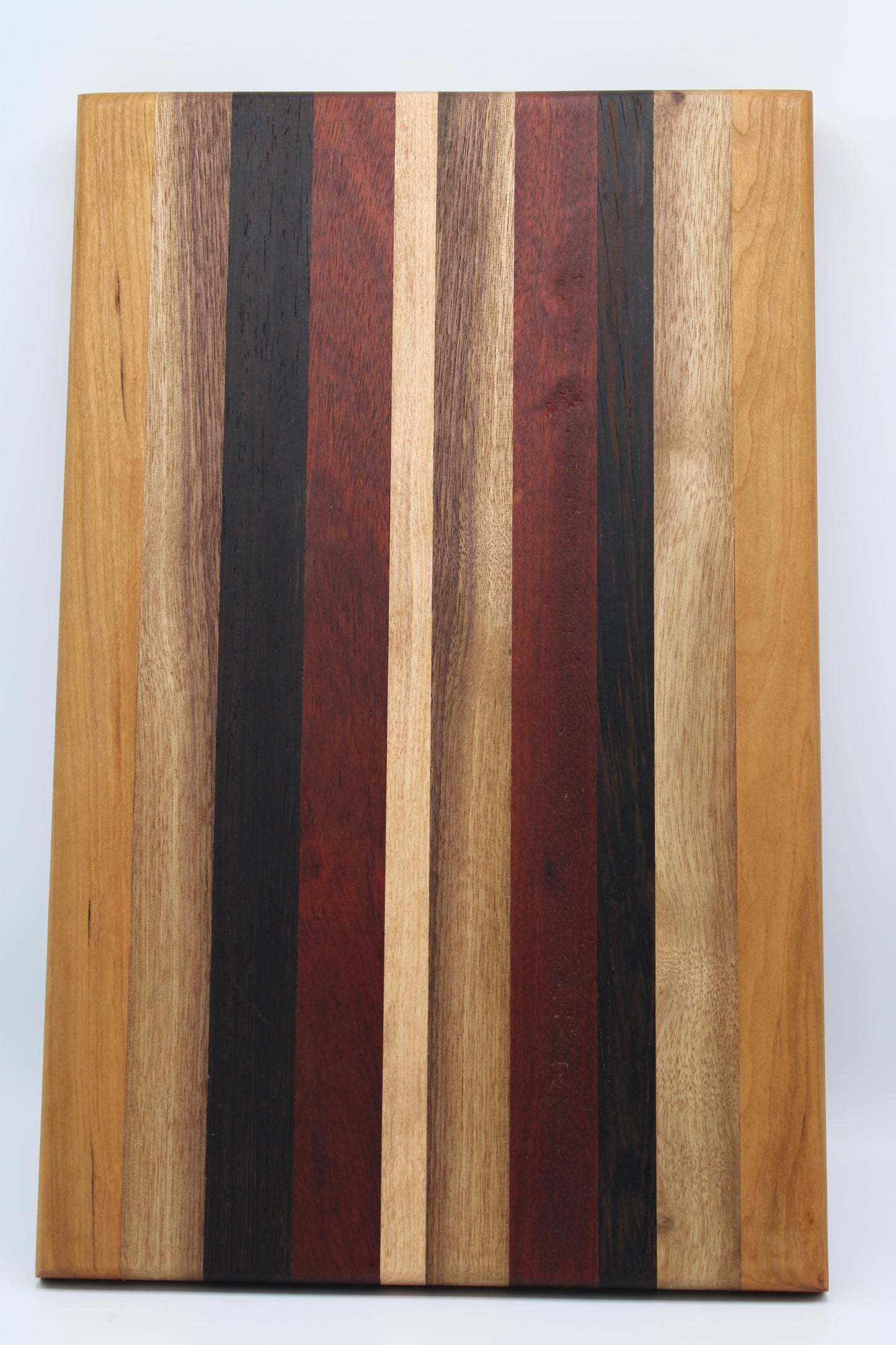 Design #003 wood used Cherry, Bloodwood, Wenge and Walnut 18x11.25.x1