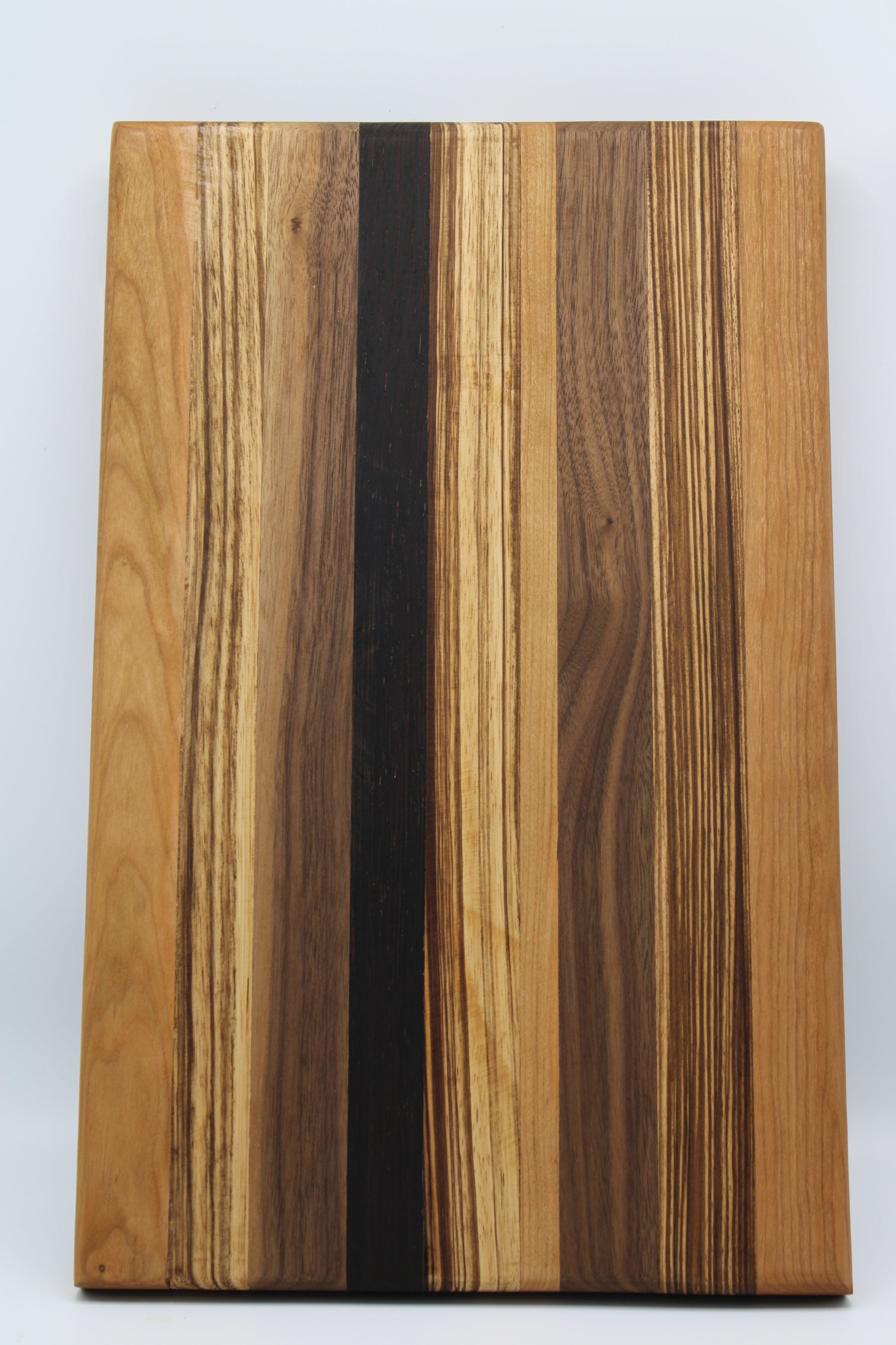 Design #009 wood used Cherry, Zebrawood, Wenge and Walnut 16x10x1