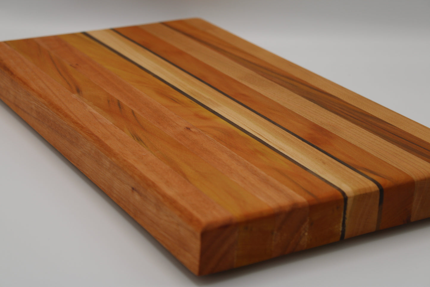 Design #035 wood used Yellowheart, Walnut, Red Grandis, Cherry 15.75x9x1.25