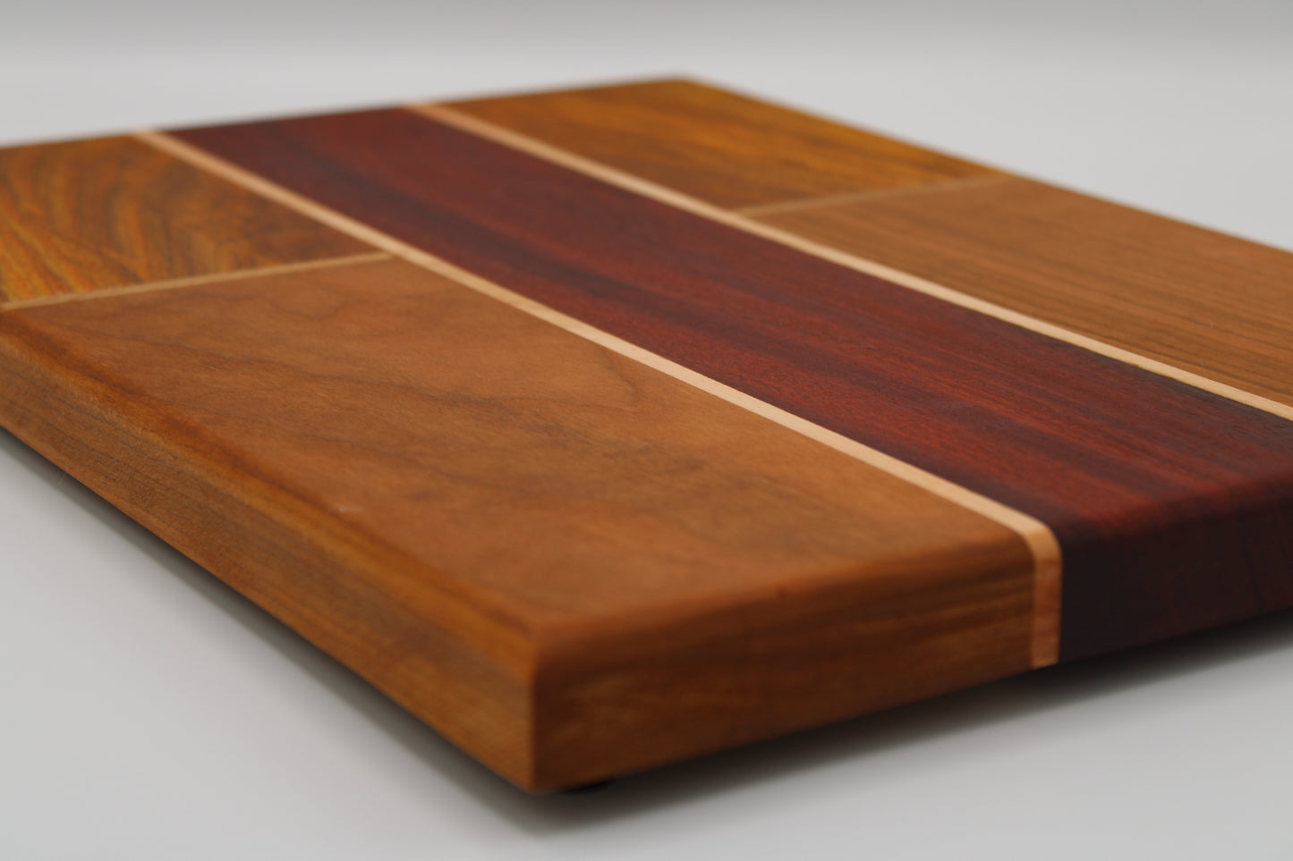 Design #039 wood used Cherry, Padauk and Canarywood 14x10x1