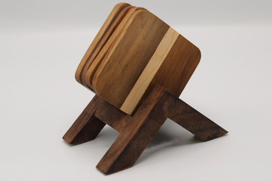 wooden coasters in a stand on a white background