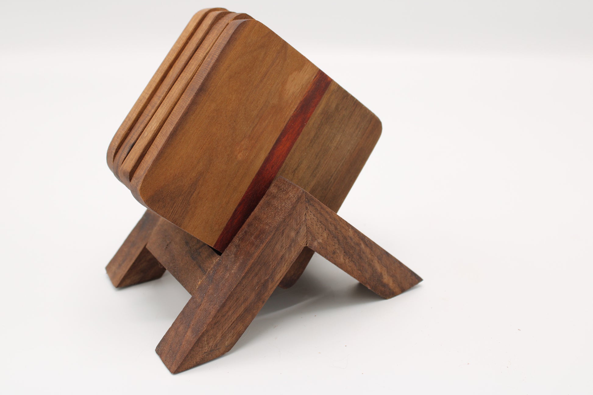 Wooden coasters with stand on white background