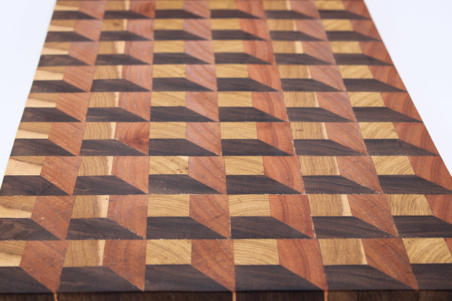 Wooden cutting board with a geometric pattern on a white background