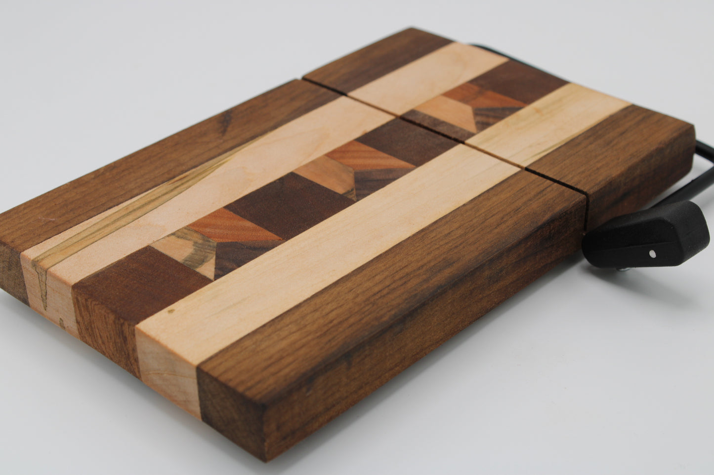 Wooden cheese  board with slicer on a white background