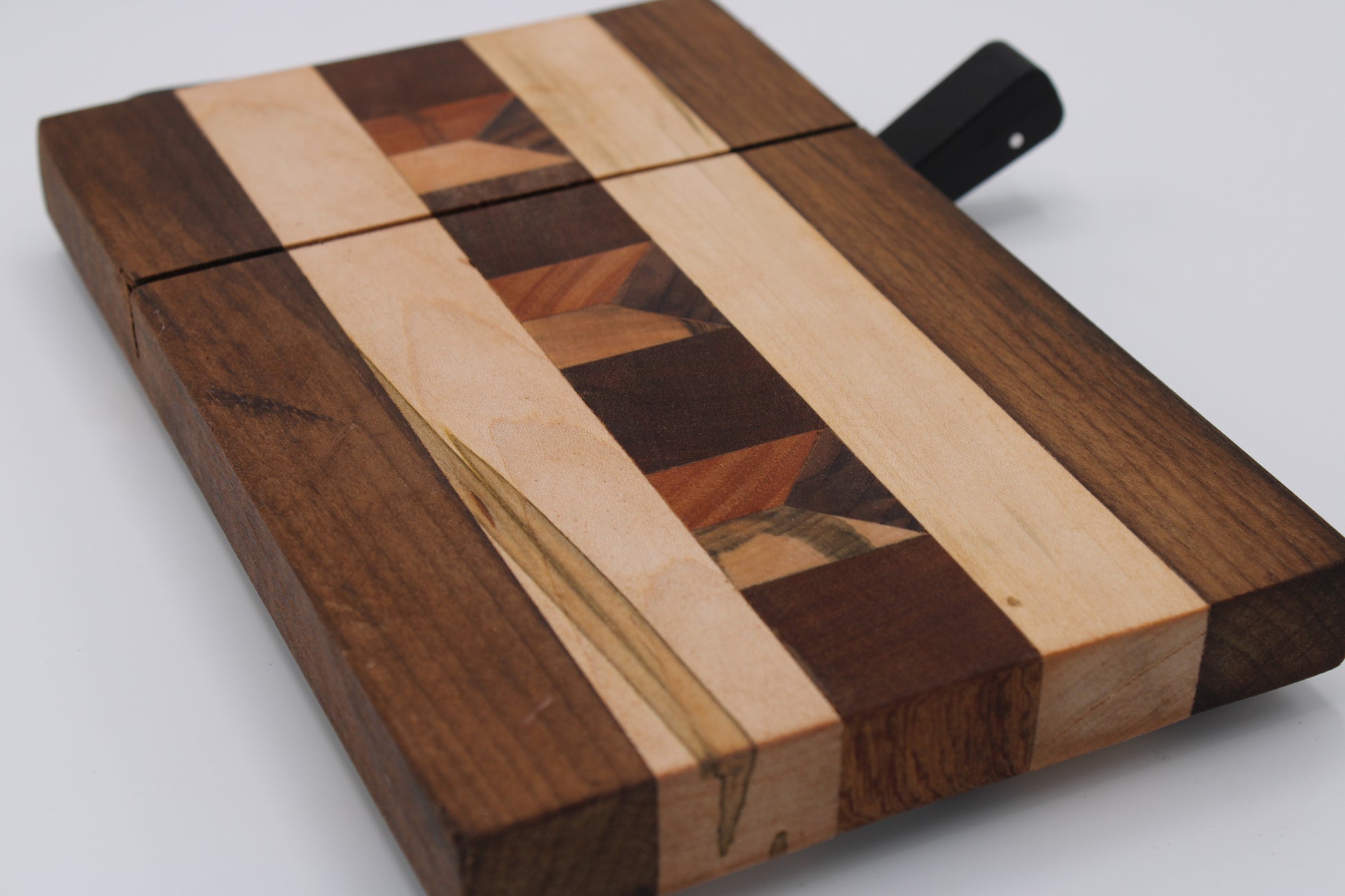Wooden cheese  board with slicer on a white background