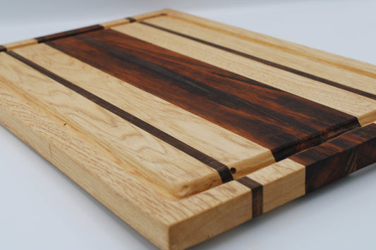 Wooden cutting board with stripe design on white background