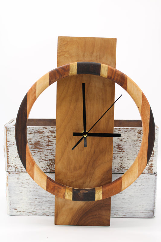 Wooden wall clock with a circular design on a wooden background