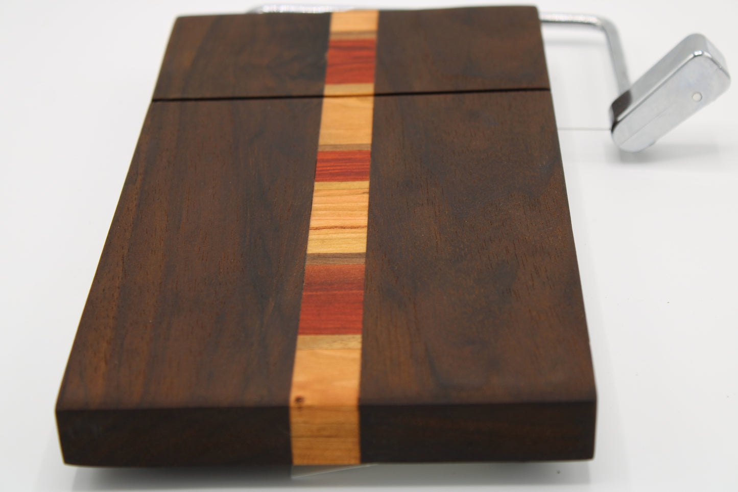 Wooden coffee grinder with a multicolored band on a white background