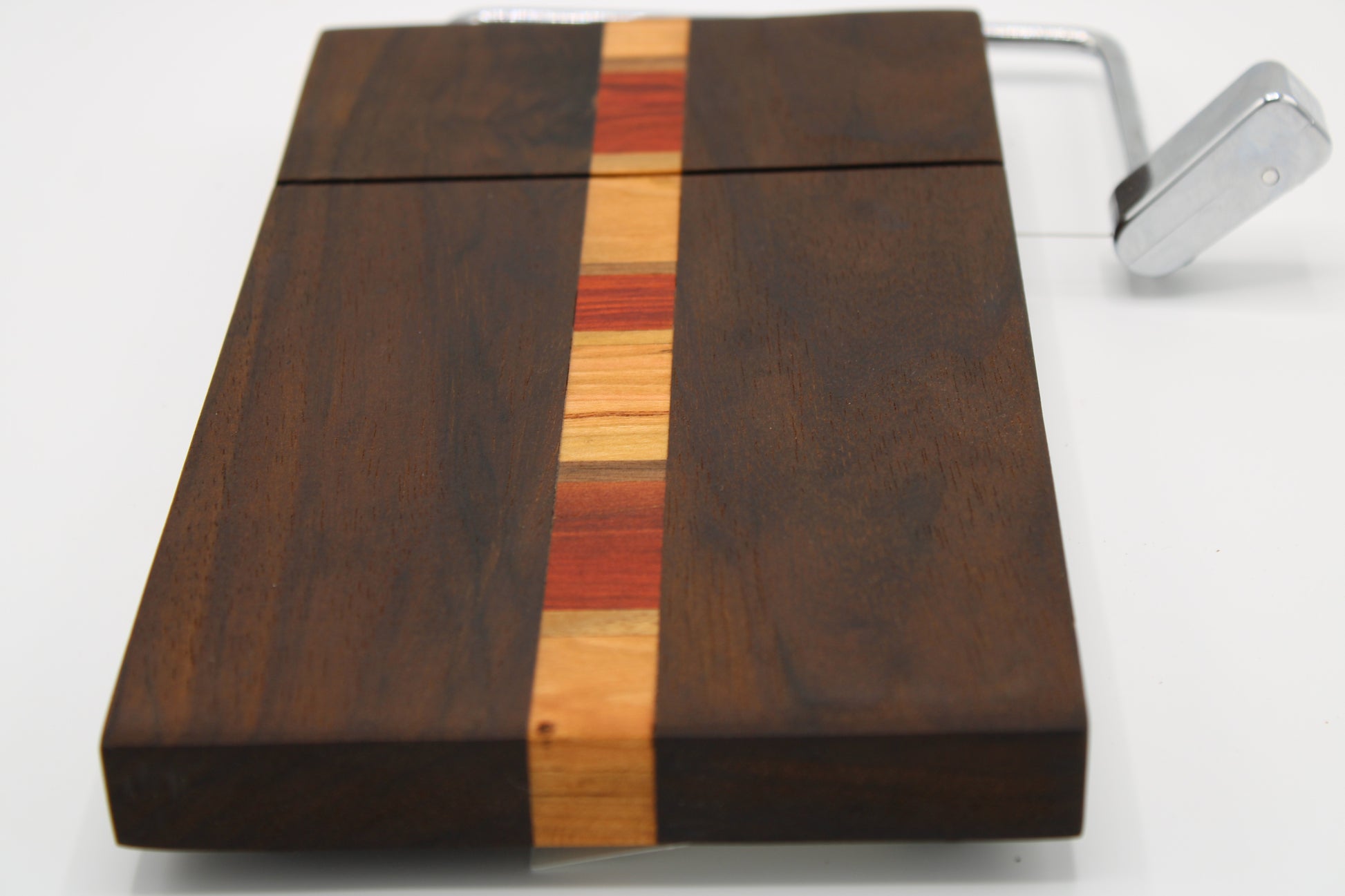 Wooden coffee grinder with a multicolored band on a white background