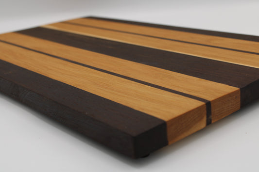 Wooden cutting board with striped pattern on a white background