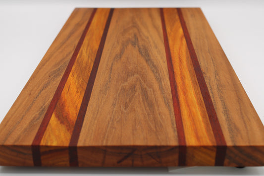 Wooden cutting board with a striped pattern on a white background