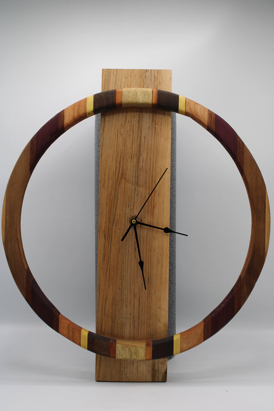 Wooden wall clock with a circular design on a plain background