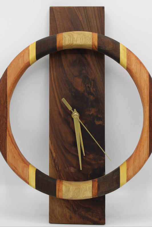 Wooden wall clock with a circular design on a white background