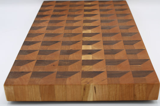 Wooden cutting board with geometric pattern on a white background