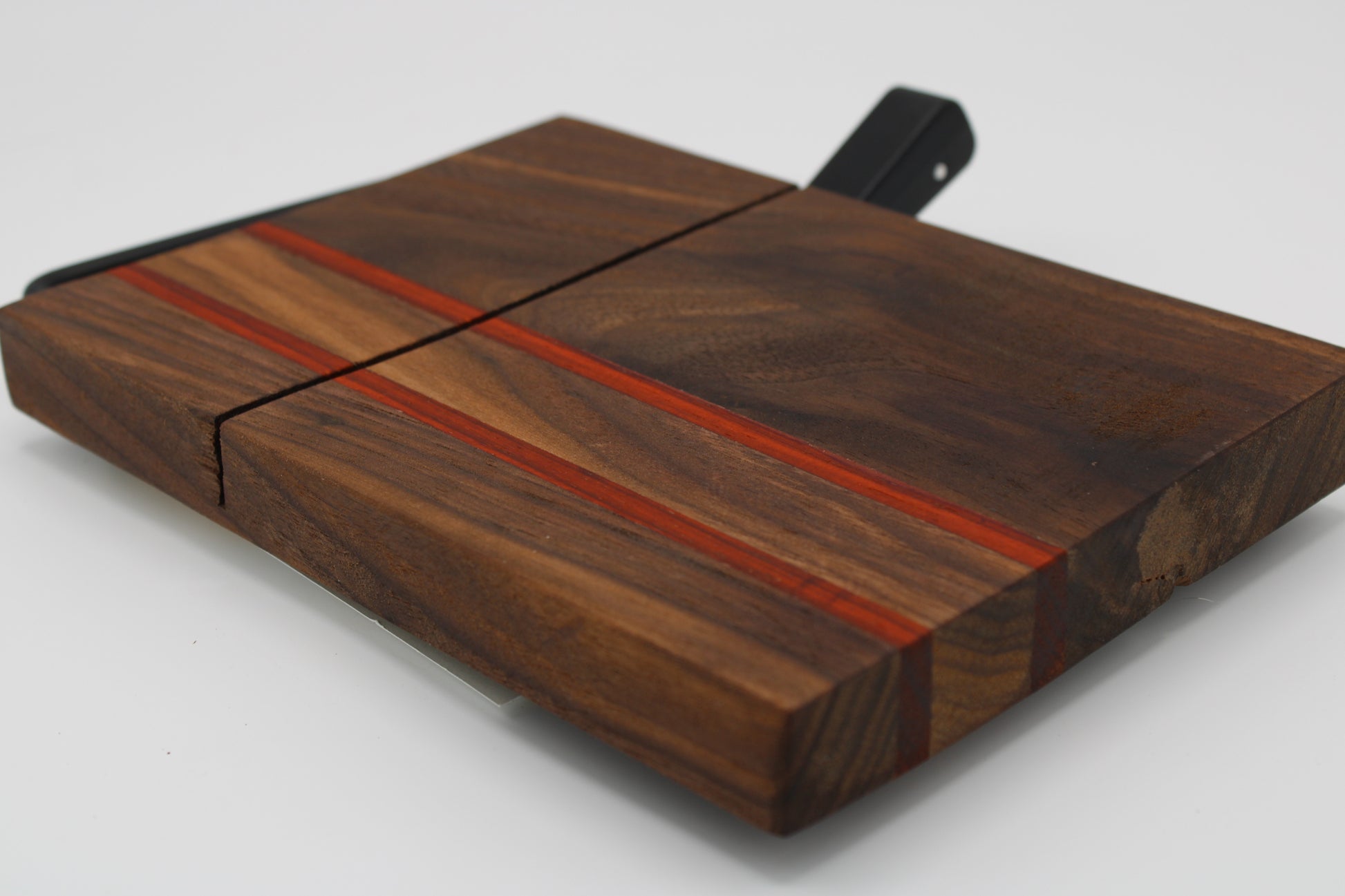 Wooden cheese board with slicer on a white background