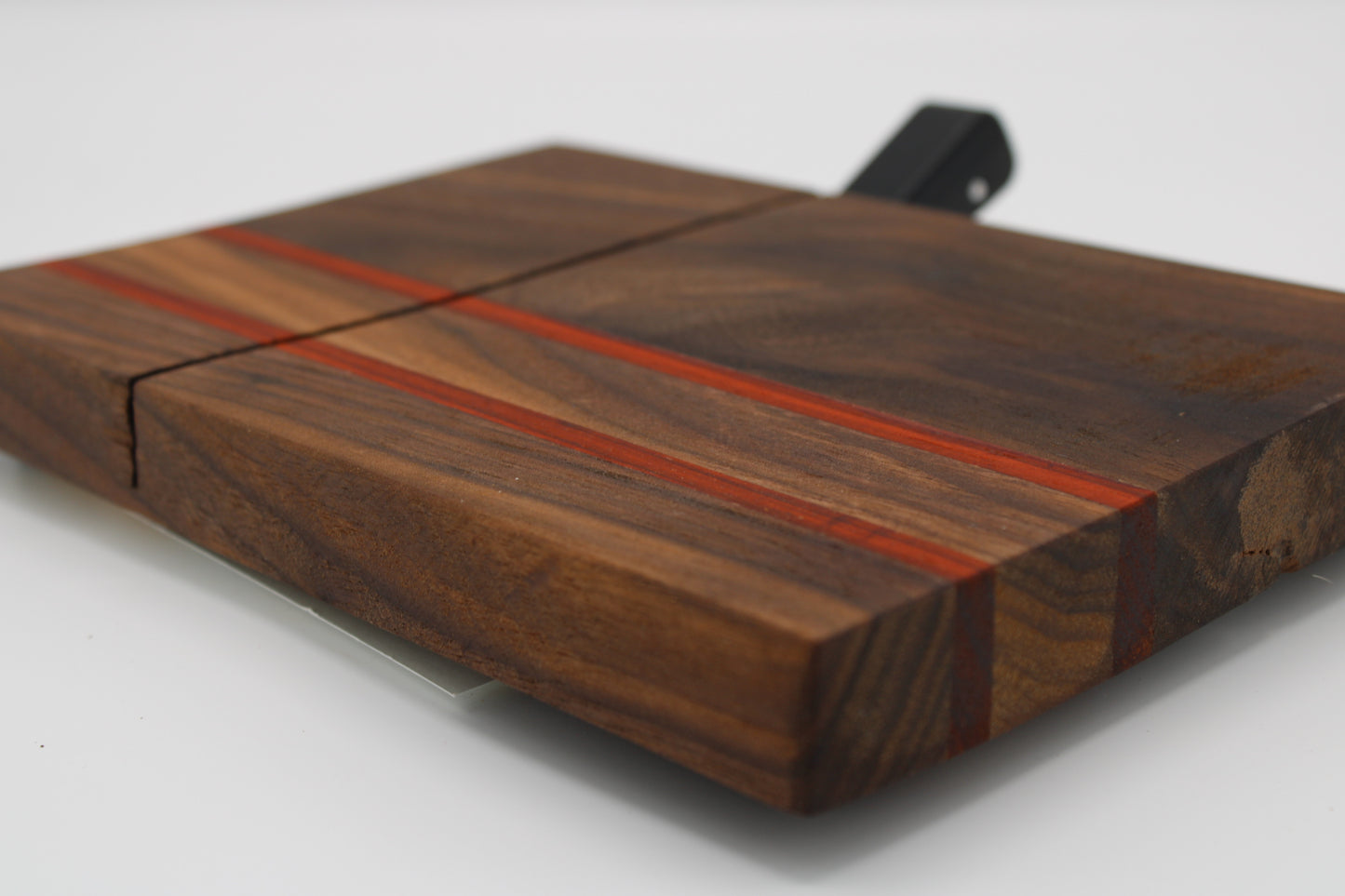 Wooden cheese board with slicer on a white background