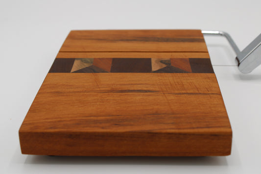 Wooden cheese board with slicer on a white background