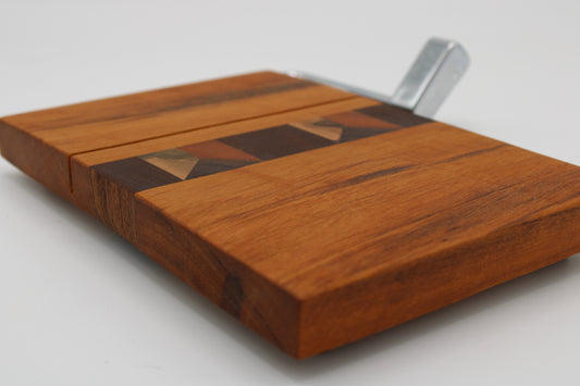 Wooden cheese board with slicer on a white background