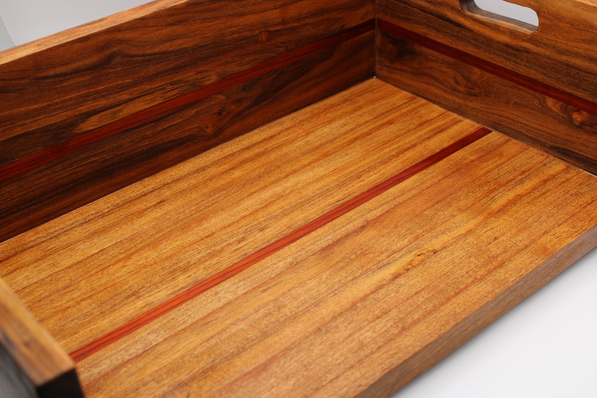 Wooden BBQ Chopping Box with a handles on a light gray background