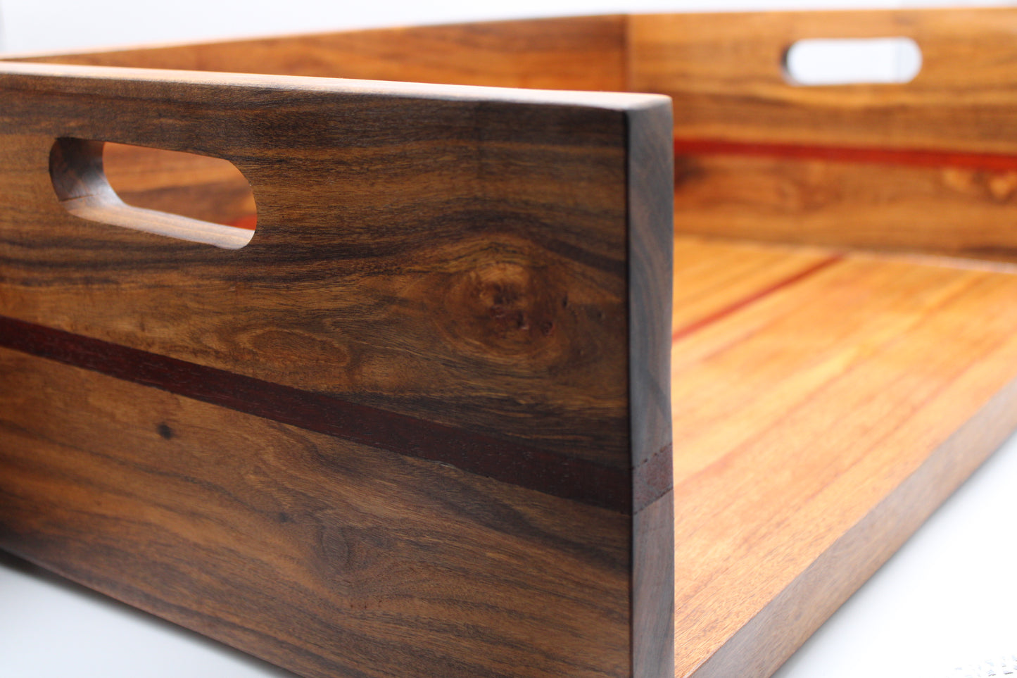 Wooden BBQ Chopping Box with a handles on a light gray background