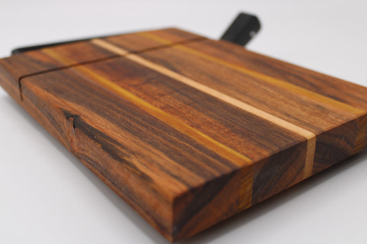 Wooden cheese cutting board with slicer on a light gray background