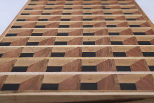 Wooden cutting board with a 3-D geometric pattern on a white background